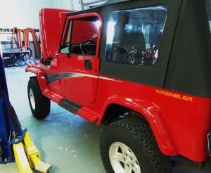 Jeep YJ in Mishimoto shop 