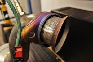 Stock downpipe turbocharger flange