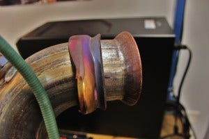 Stock downpipe turbocharger flange