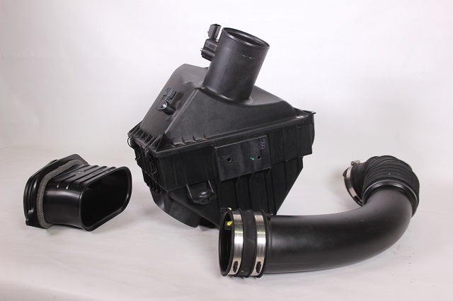 Components of stock Nissan Titan air intake