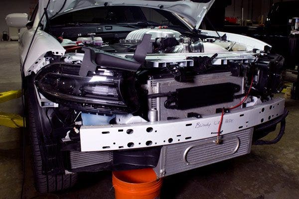 The front end of this Charger is covered in heat exchangers, including a beautiful liquid-to-air intercooler, complete with a nitrous spray system.