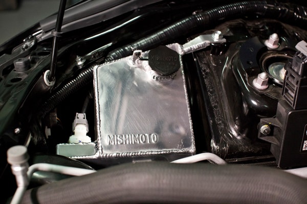 The Mishimoto tank, viewed from the driver's side of the engine bay.