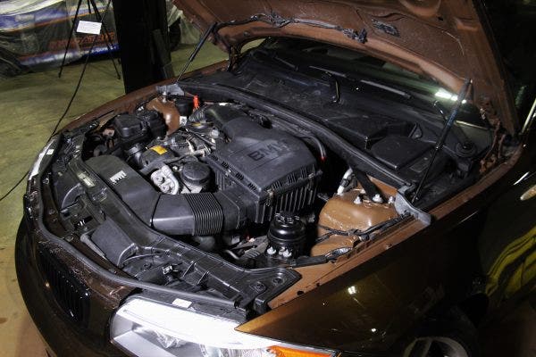 The driver side of the BMW 135i engine bay.