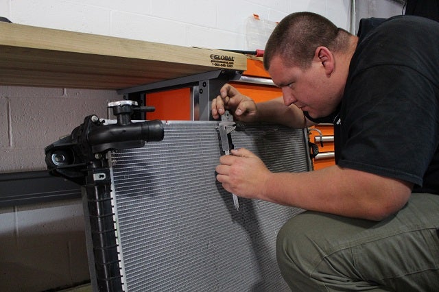 Dan measuring the fins of the stock Nissan Titan XD radiator