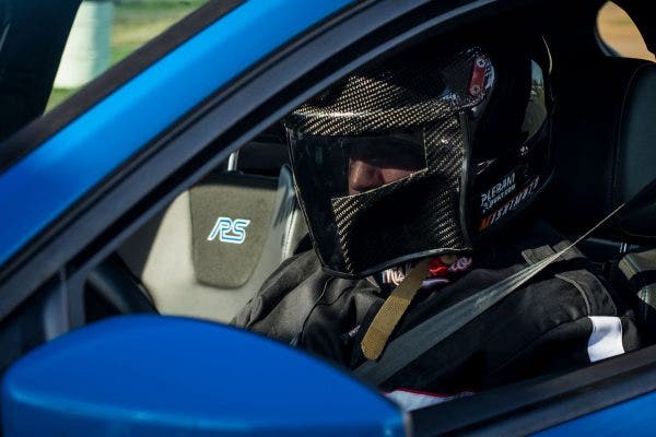 A suited-up Eric Plebani gets ready to set off for a round of testing to the RS's AWD system.