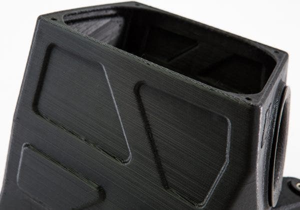These grooves are more than just for looks. They're for added structural integrity. Our plan is for a linear low-density polyethylene (LLDPE) construction. While this is regarded as a strong plastic material, Ye still wanted to make sure it could stand up to the rigors of the Accord's engine bay. The eccentric design does just that. 