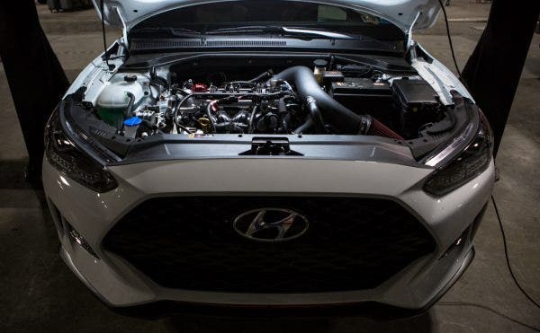 The Veloster is not a large car by any means. Still, with the engine cover installed and aftermarket intake kit, there was plenty of room for our engineer to work with.