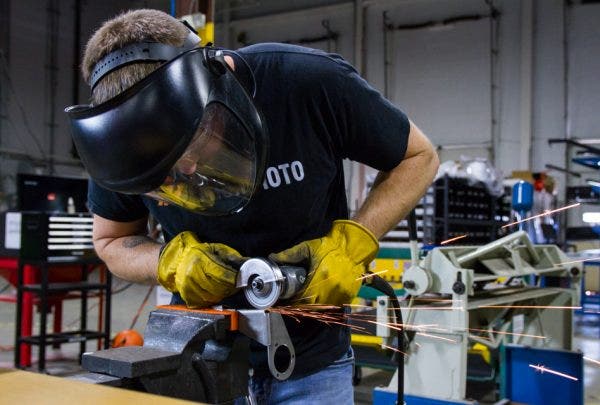 Mike, our master fabricator, makes some adjustments to the prototype bracket to ensure a perfect fit.