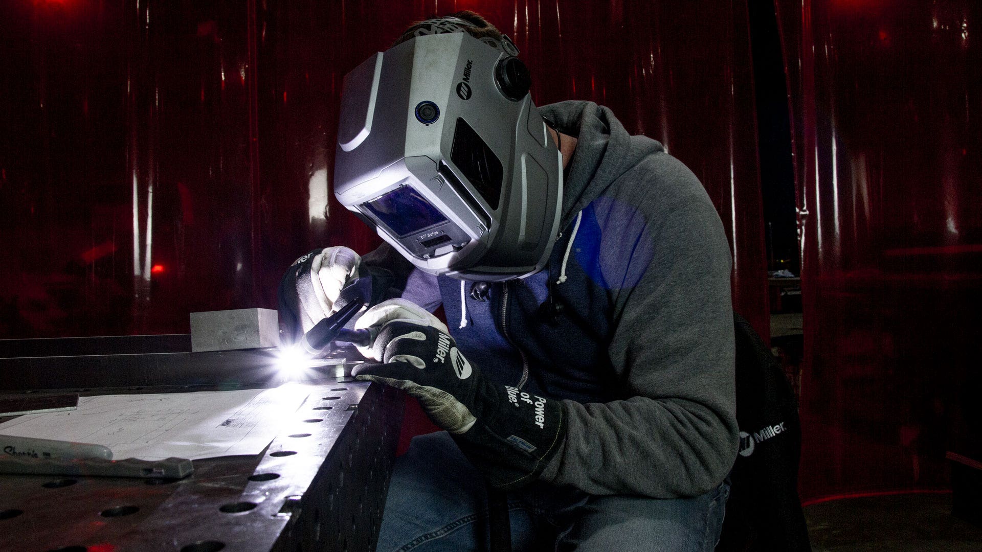 Mishimoto engineer welding to create a transmission cooler prototype.